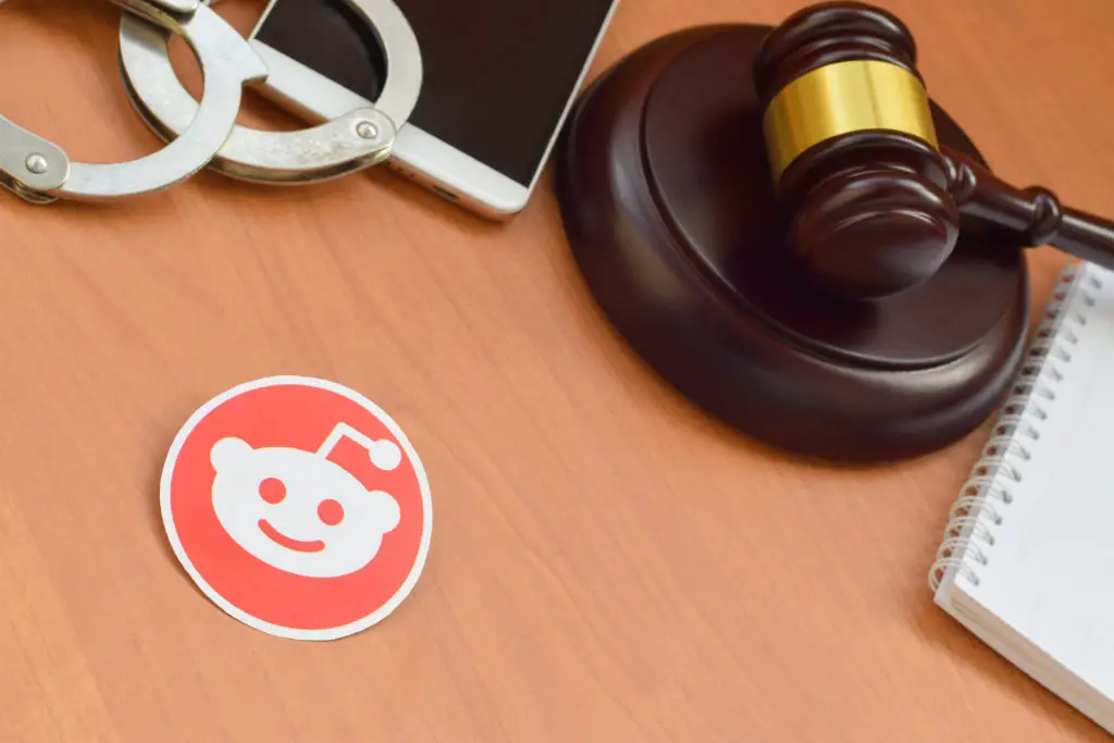 A gavel next to a smartphone