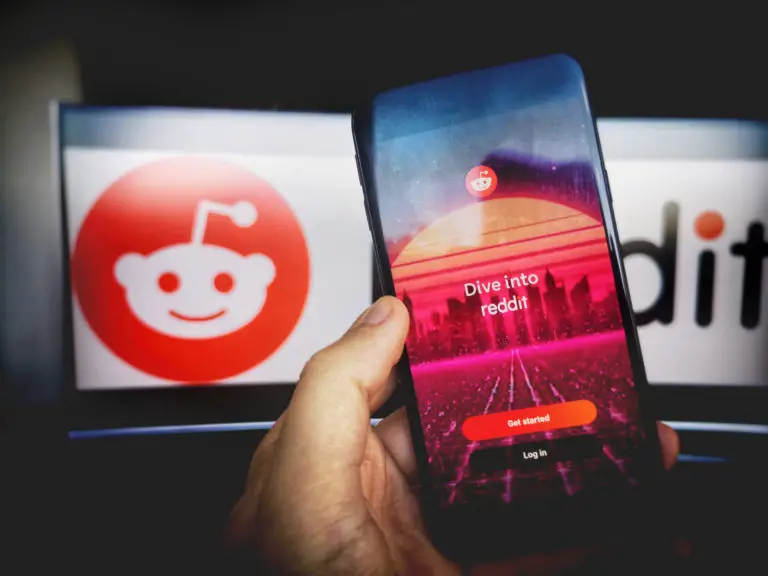 Reddit app opened on a smartphone and a computer