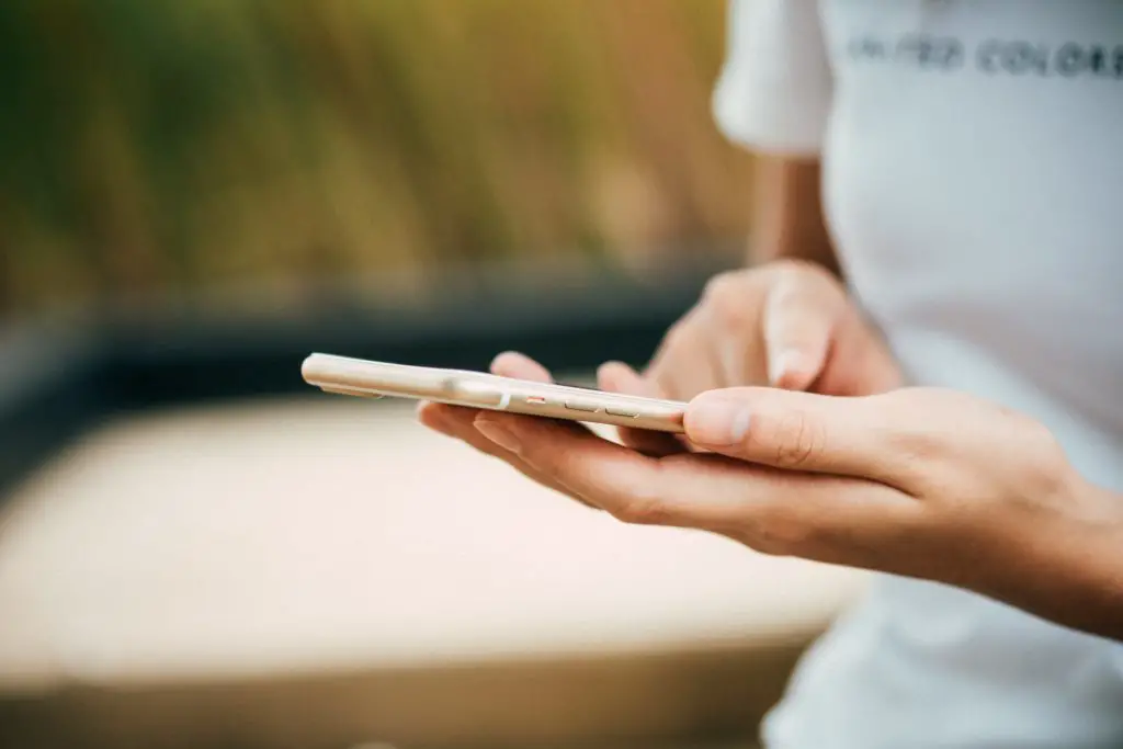 A woman holding a smartphone