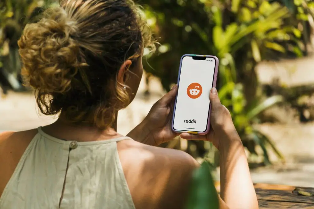 A woman holding a smartphone